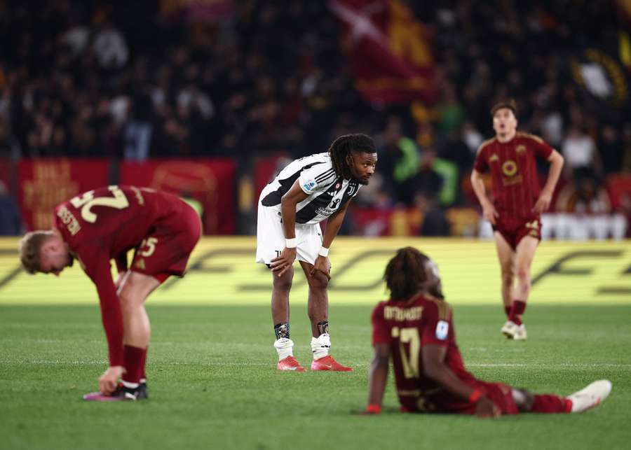 Juventus' Khephren Thuram and Roma players react after the match
